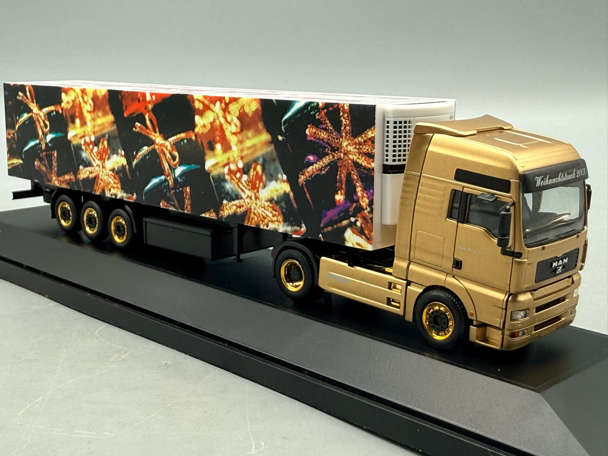 Modell LKW 1:87 Herpa MAN TGA 18.530 Weihnachtstruck 2003 mit OVP