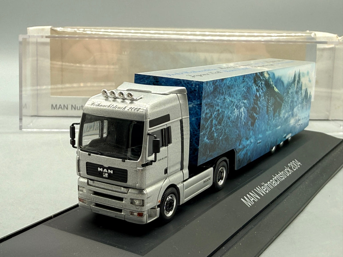 Modell LKW 1:87 Herpa MAN TGA 18.530 Weihnachtstruck 2004 mit OVP