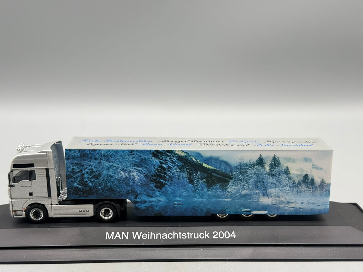 Modell LKW 1:87 Herpa MAN TGA 18.530 Weihnachtstruck 2004 mit OVP