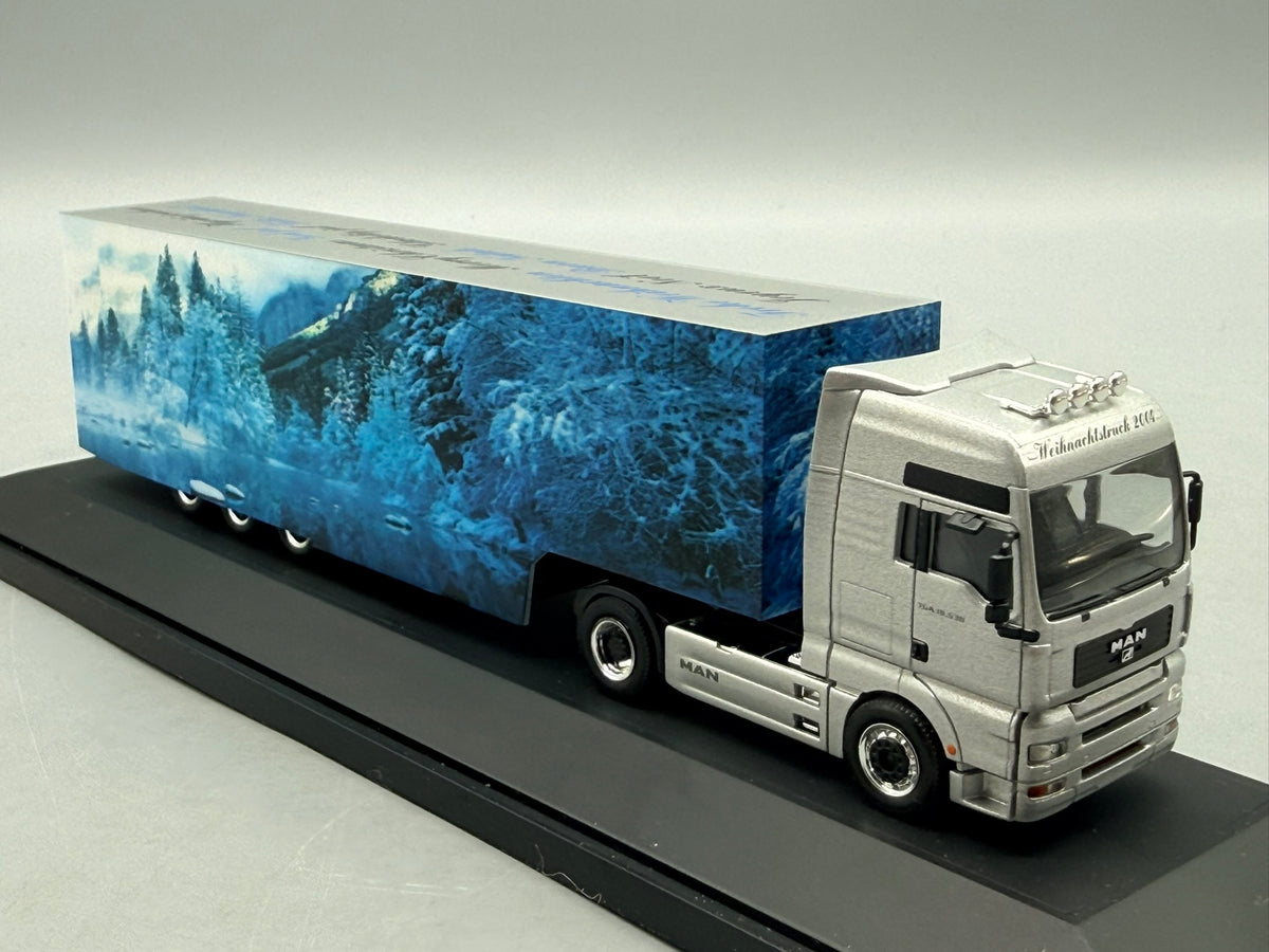 Modell LKW 1:87 Herpa MAN TGA 18.530 Weihnachtstruck 2004 mit OVP