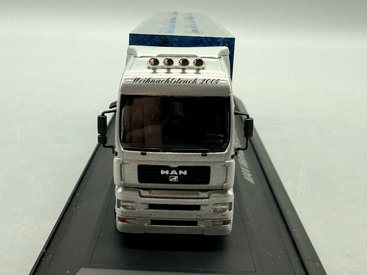 Modell LKW 1:87 Herpa MAN TGA 18.530 Weihnachtstruck 2004 mit OVP