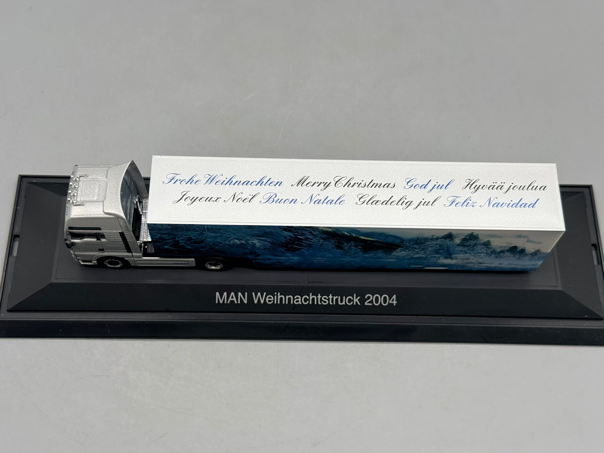 Modell LKW 1:87 Herpa MAN TGA 18.530 Weihnachtstruck 2004 mit OVP