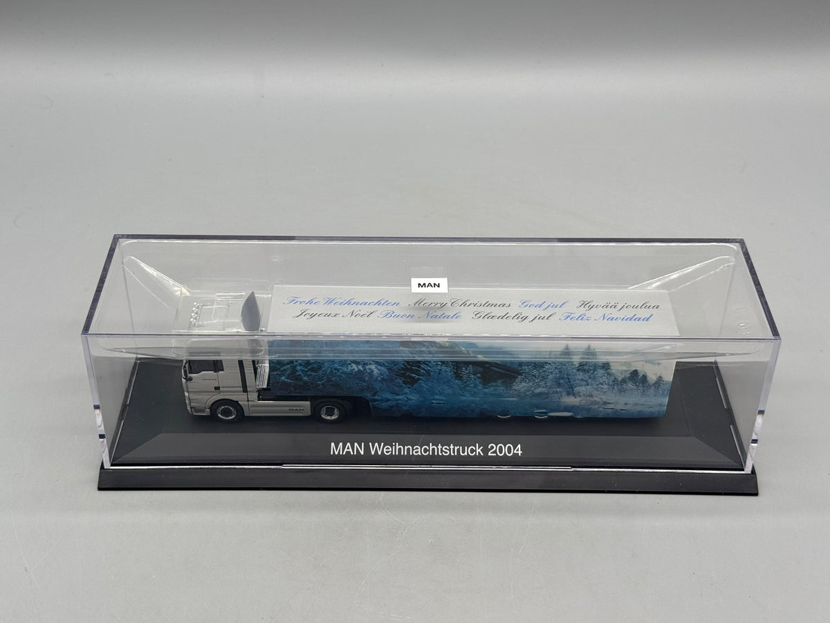 Modell LKW 1:87 Herpa MAN TGA 18.530 Weihnachtstruck 2004 mit OVP
