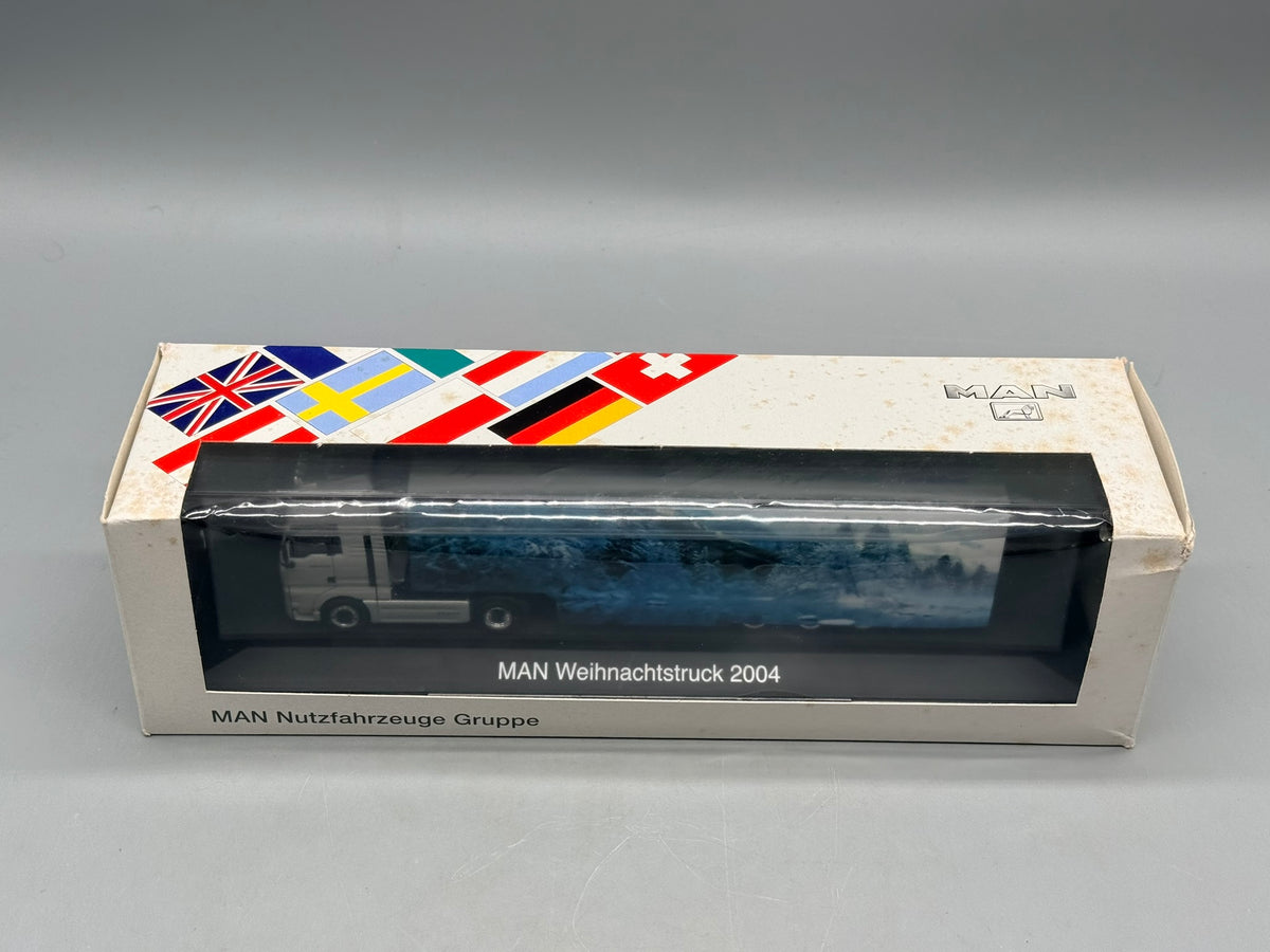 Modell LKW 1:87 Herpa MAN TGA 18.530 Weihnachtstruck 2004 mit OVP
