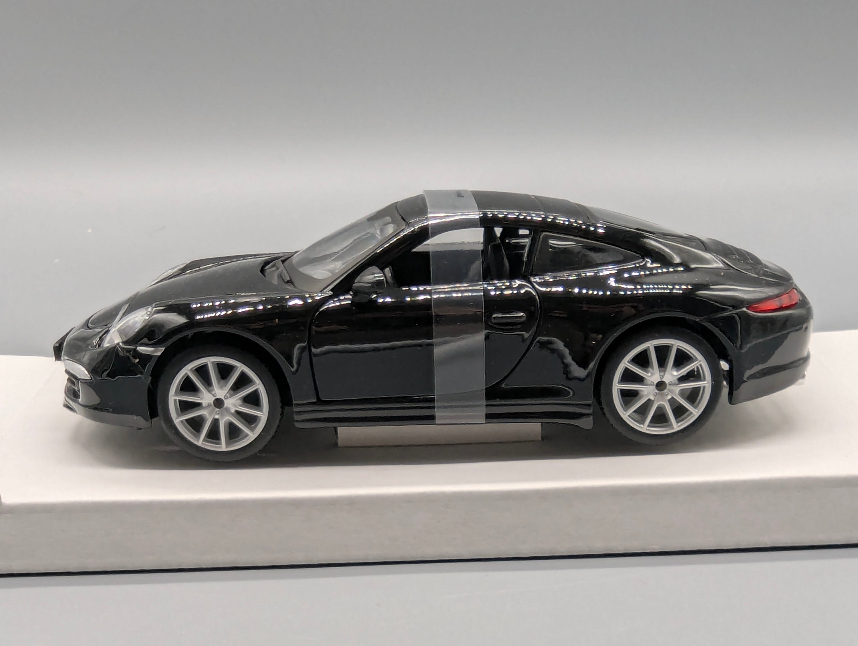 Modellautos 1:24 Bburago Porsche 911 Carrera S Schwarz mit OVP