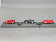 Modellautos 1:87 Herpa Ferrari 3-tlg Set 2x rot, 1x schwarz mit Vitrinen