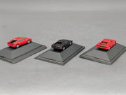 Modellautos 1:87 Herpa Ferrari 3-tlg Set 2x rot, 1x schwarz mit Vitrinen
