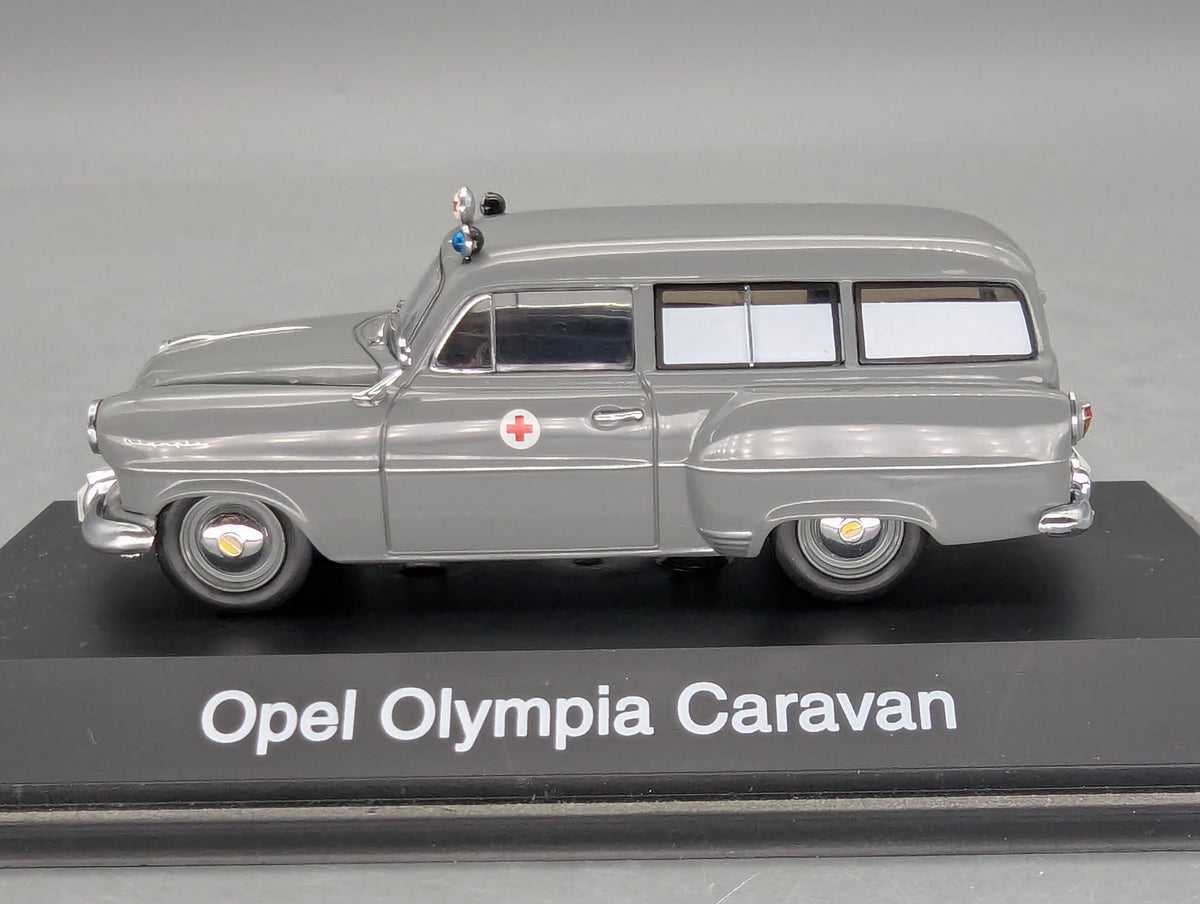 Modellautos 1:43 Schuco Opel Olympia Caravan Krankenwagen Grau mit Vitrine