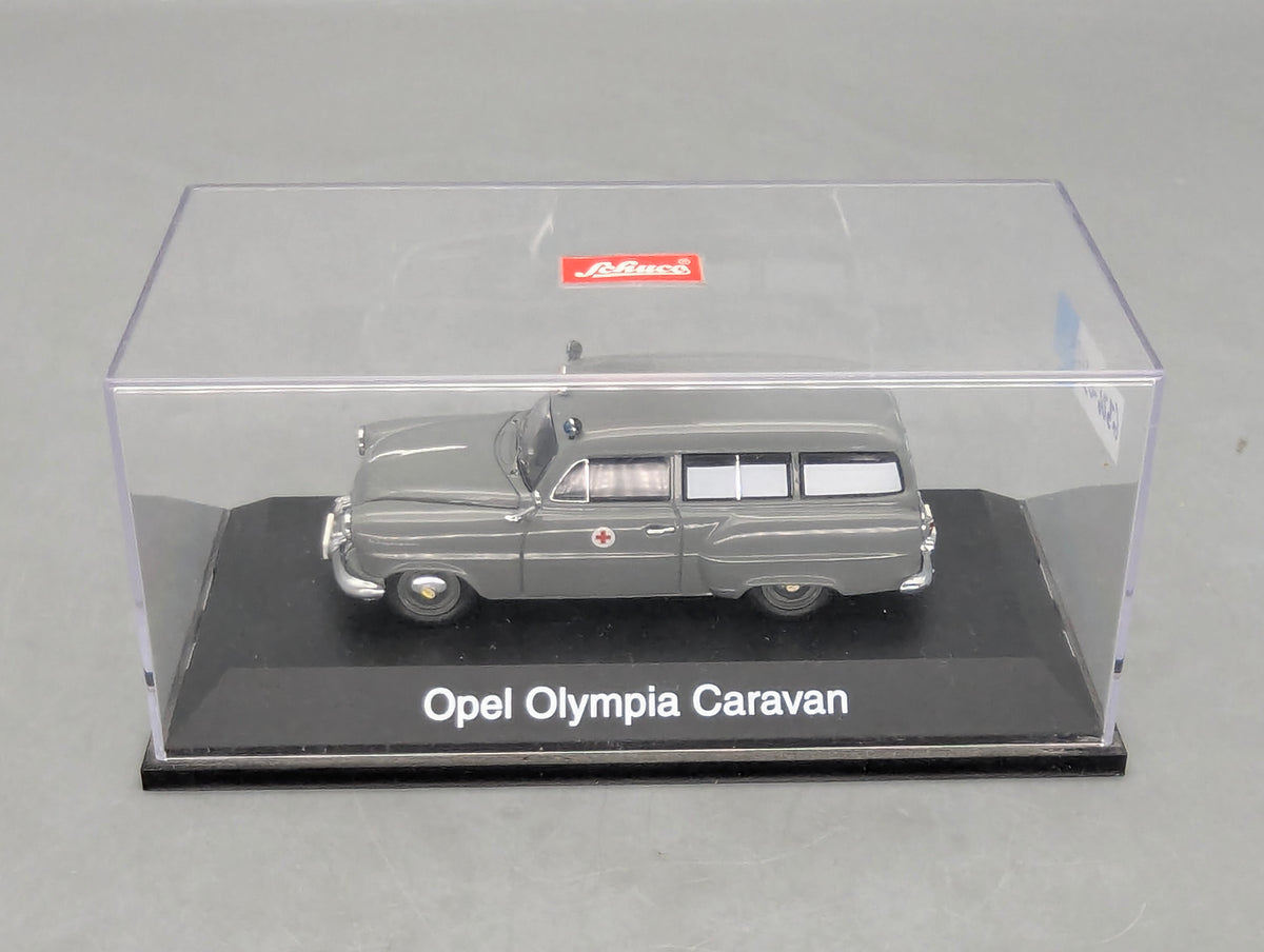 Modellautos 1:43 Schuco Opel Olympia Caravan Krankenwagen Grau mit Vitrine
