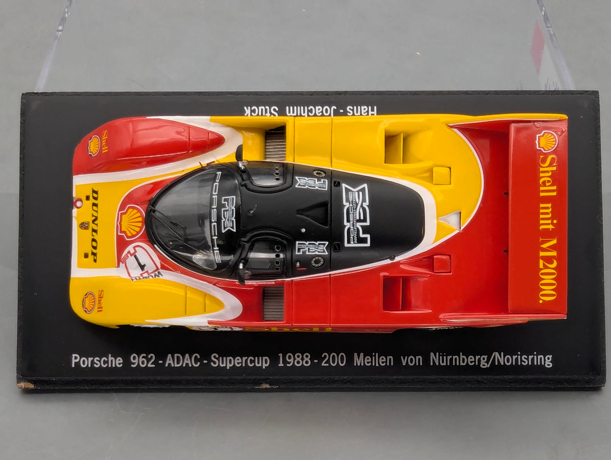 Modellautos 1:43 Spark SAM057 Porsche 962 ADAC Supercup 1988 #1 H. J. Stuck OVP