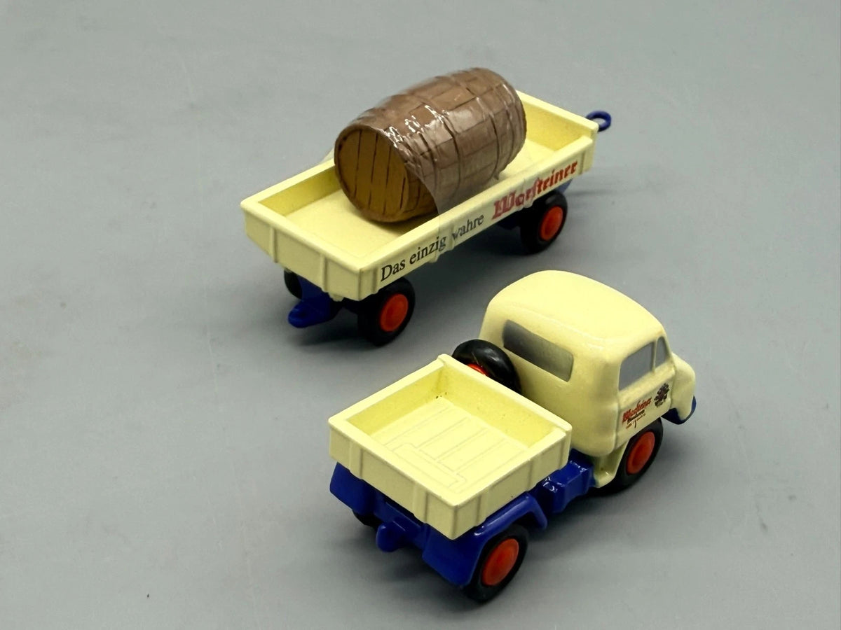 Modellautos 1:90 Schuco Piccolo 2er-Set Unimog + Anhänger Warsteiner in OVP