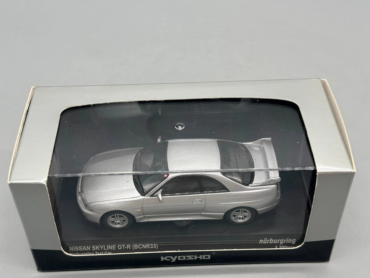 Modellautos 1:43 Kyosho Nissan Skyline GT-R (BCNR33) Test Car mit OVP