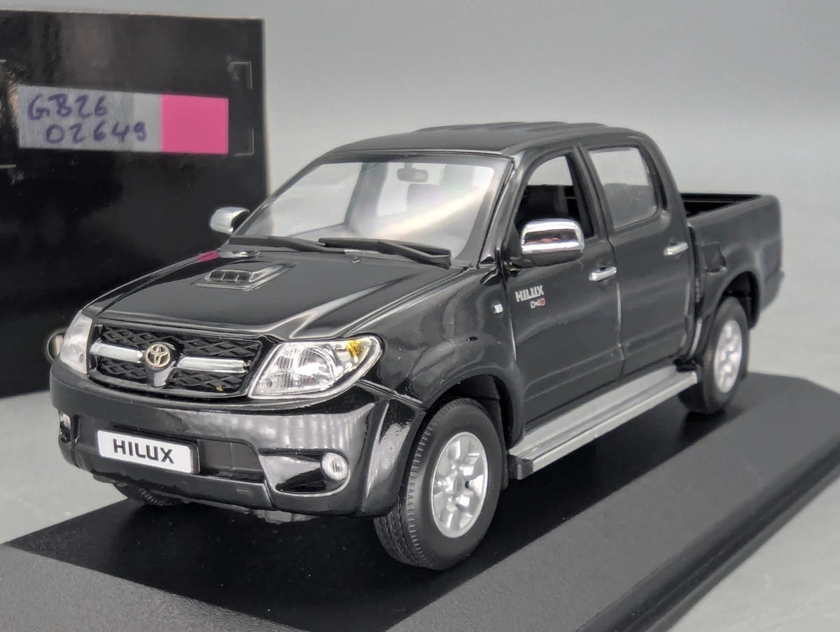 Modellautos 1:43 Minichamps Toyota Hillux Schwarz mit OVP